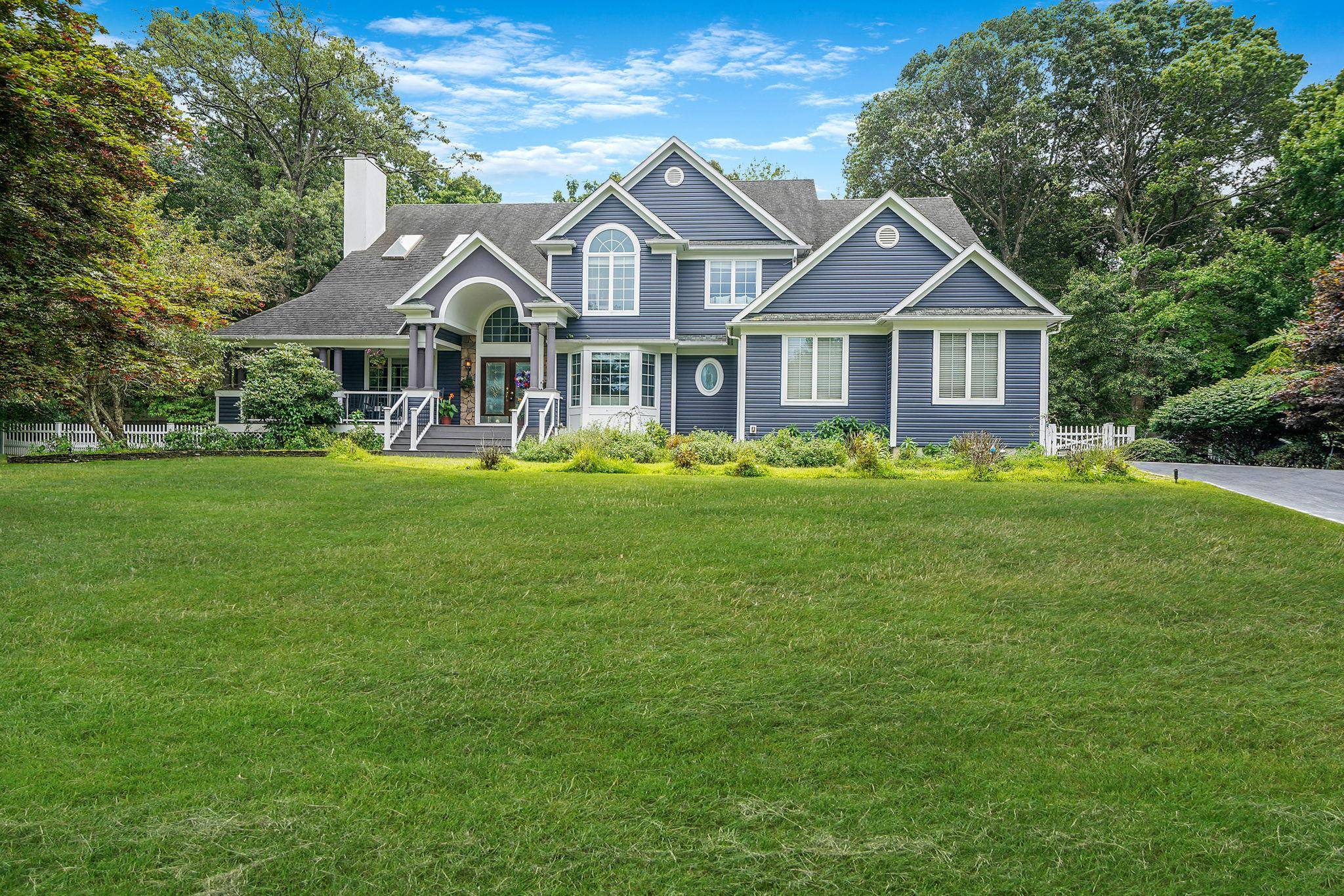 Welcome to 12 Griffen Ct, an extraordinary residence set within the prestigious North Harbor community of Miller Place, just minutes from the coveted sands of Cedar Beach.