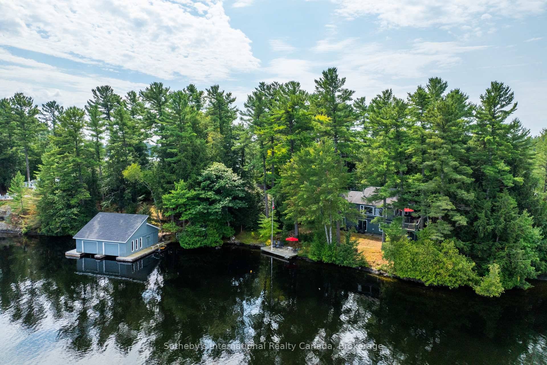 Nestled on the serene shores of Lake Muskoka, this year round cottage offers 385 feet of beautiful, tree lined shoreline, along with a detached garage and a two slip boathouse.