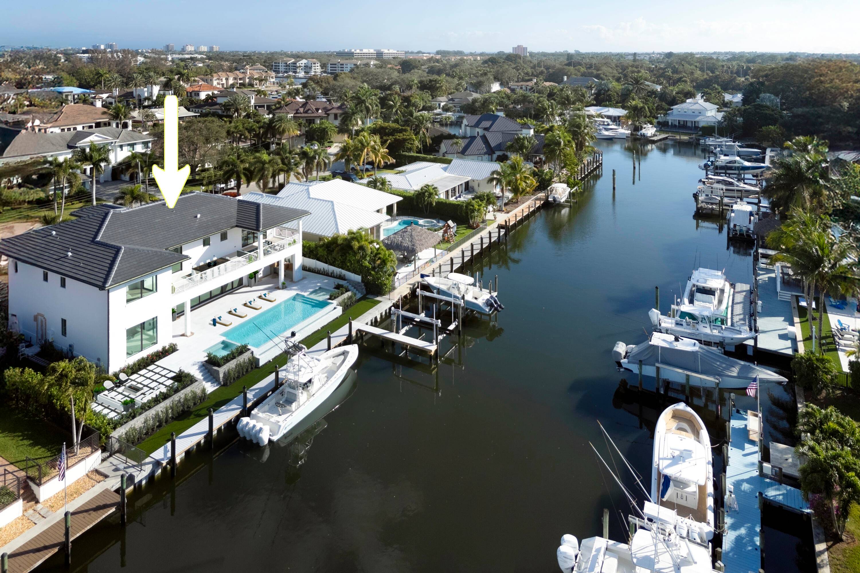 This extraordinary new construction waterfront estate offers a refined lifestyle of sophistication, elegance, and seamless indoor outdoor living.