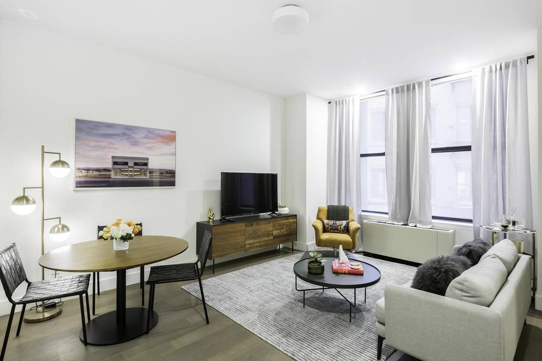 One Bedroom One Bath Home Experience urban elegance at The Broad Exchange Building.