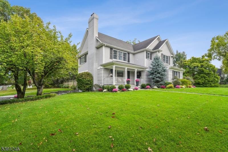 Perched on a corner lot in one of Summit's most sought after neighborhoods, this extensively renovated Colonial perfectly blends luxury and functionality.