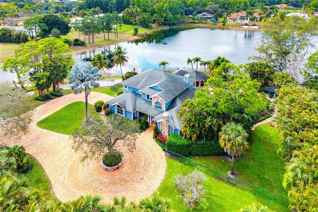 Welcome to a truly rare gated waterfront estate set on 1.