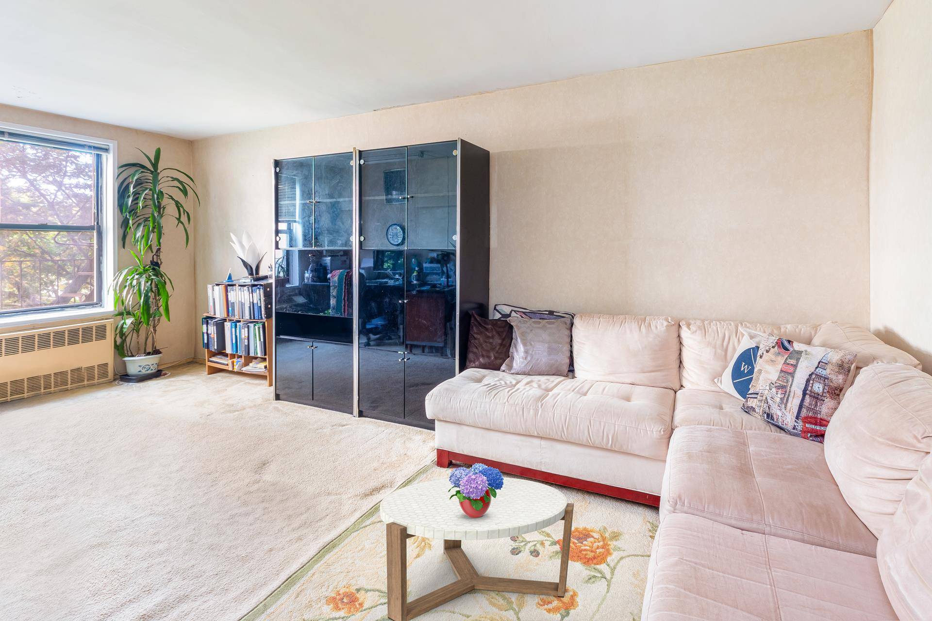 Welcome to a charming and delightful condo located at 100 25 Queens Boulevard in the vibrant neighborhood of Forest Hills.