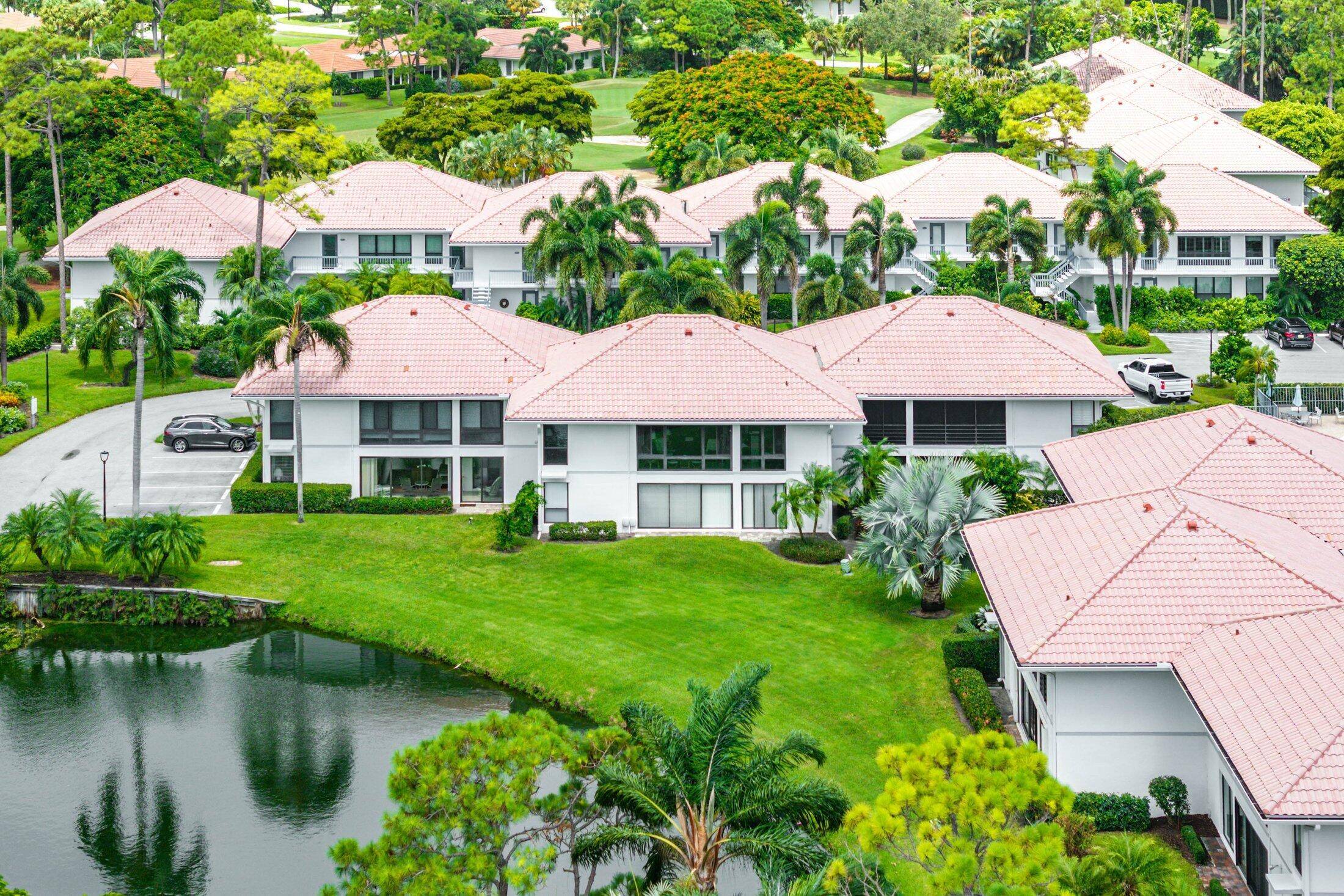 Just steps to the driving range from this 2 Bedroom, 2 Bath First Floor Residence with Pond View in the Osprey area of Quail Ridge.
