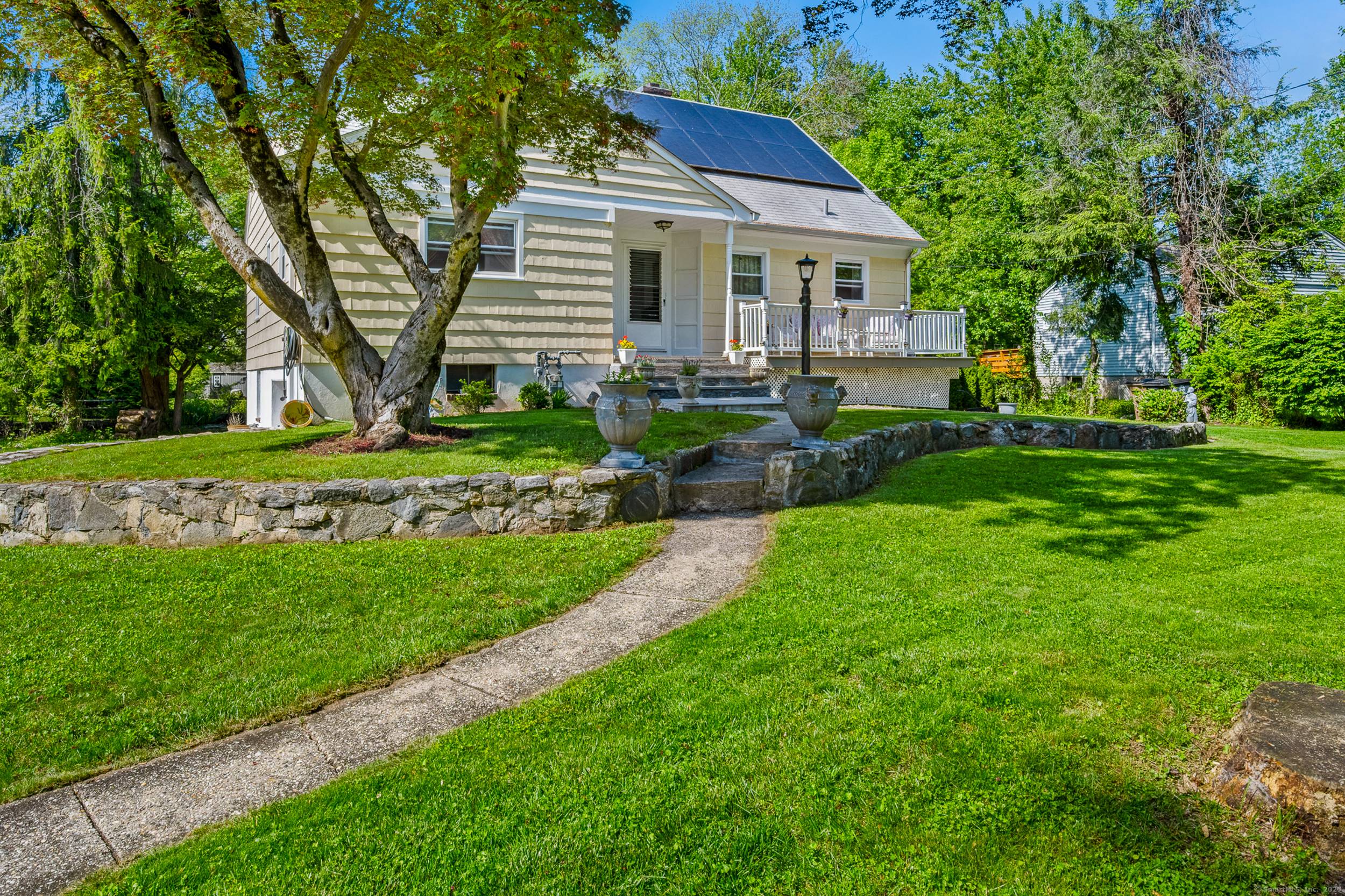 Extremely Well Kept custom Built Cape With 4 Bedrooms and 3 Full Bath, Lovely Living Room with Wood Fireplace, decorated walls with beautiful stone walls, Eat In Kitchen with newer ...