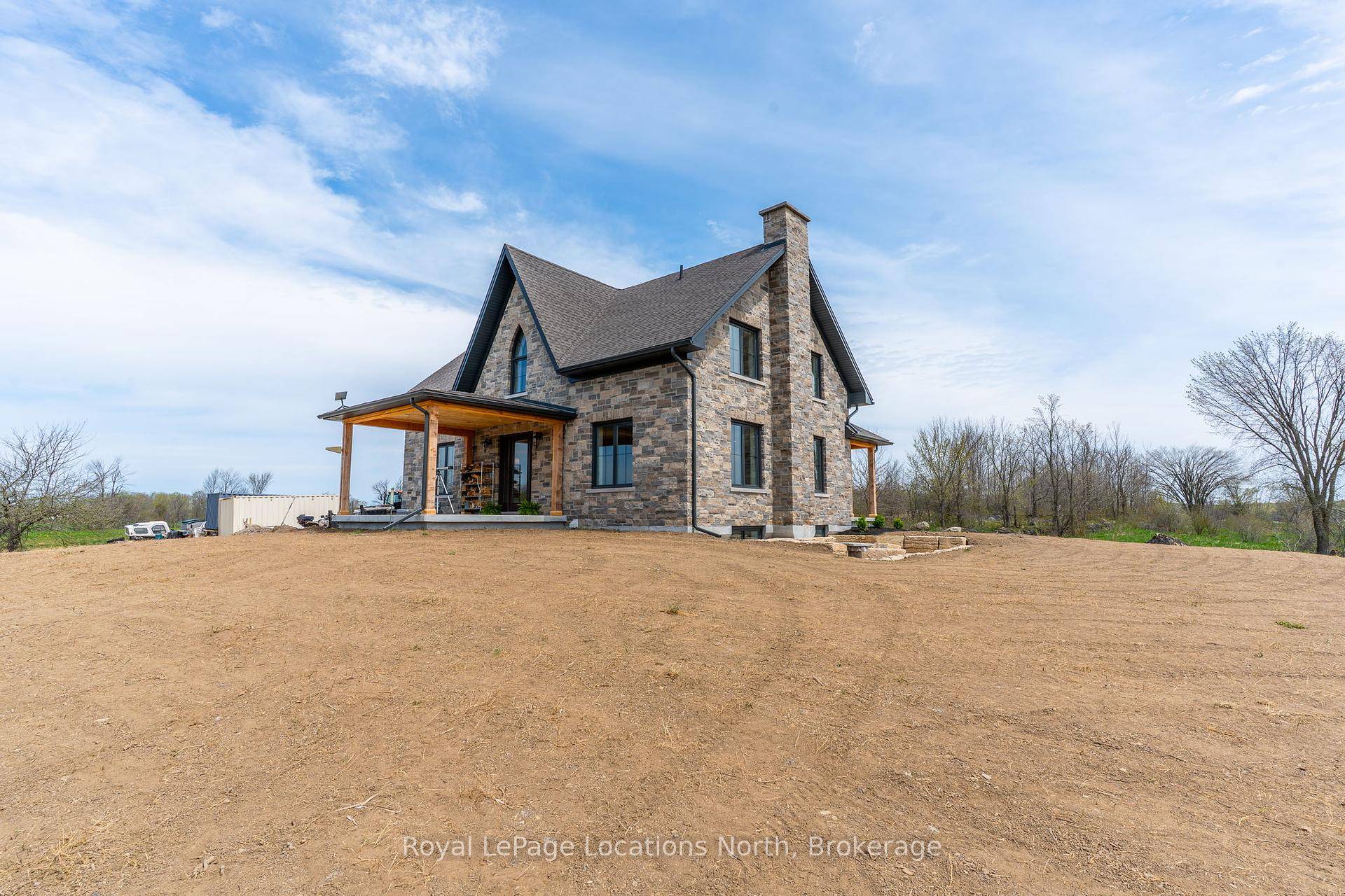 Welcome to this breathtaking, brand new stone Gothic Farmhouse, where old world charm meets modern luxury on a picturesque 65 acre estate.