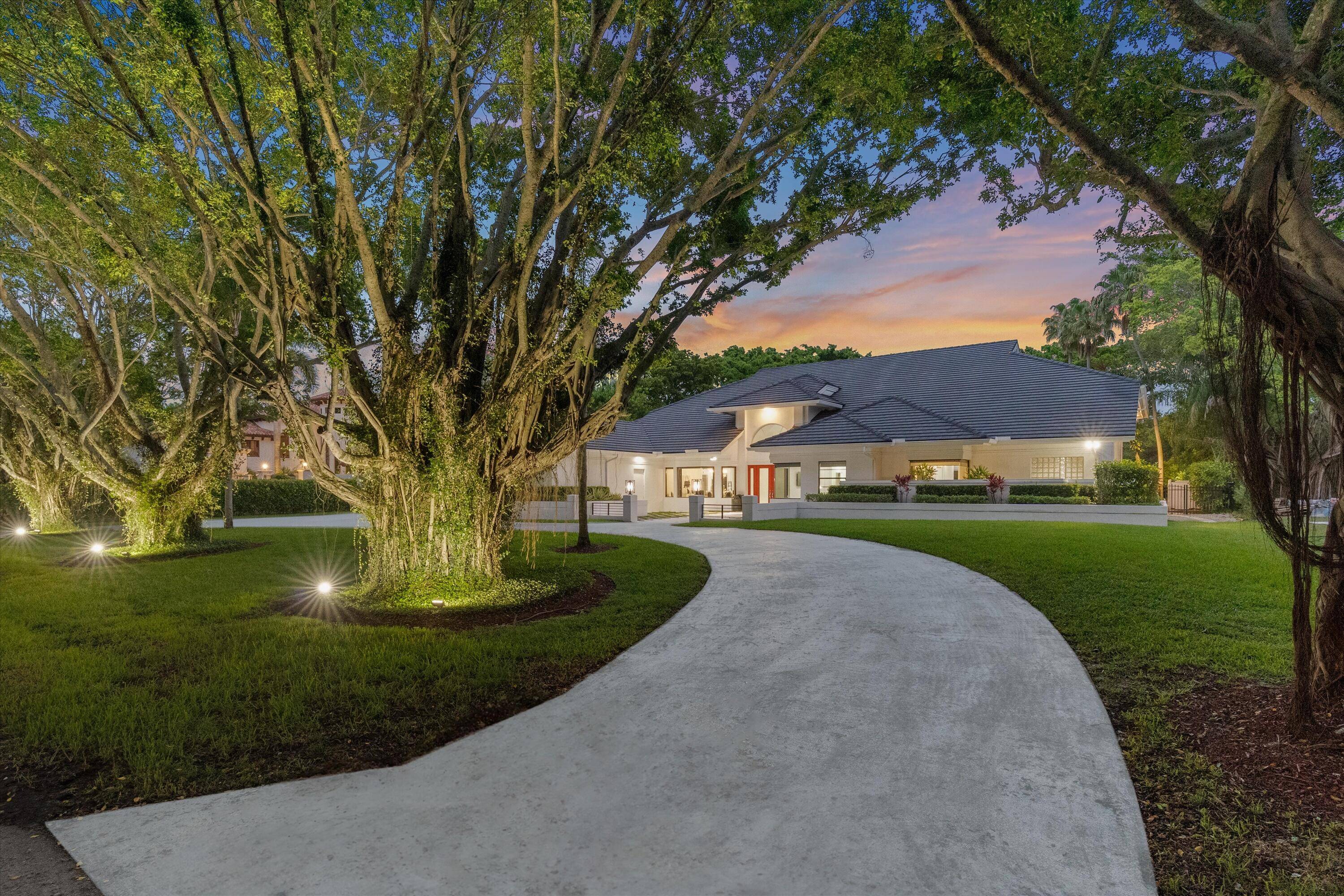 A very rare offering in the exclusive enclave of Long Lake Estates of Boca Raton this exceptional showcase home rests on a private 48, 000 SF lot.