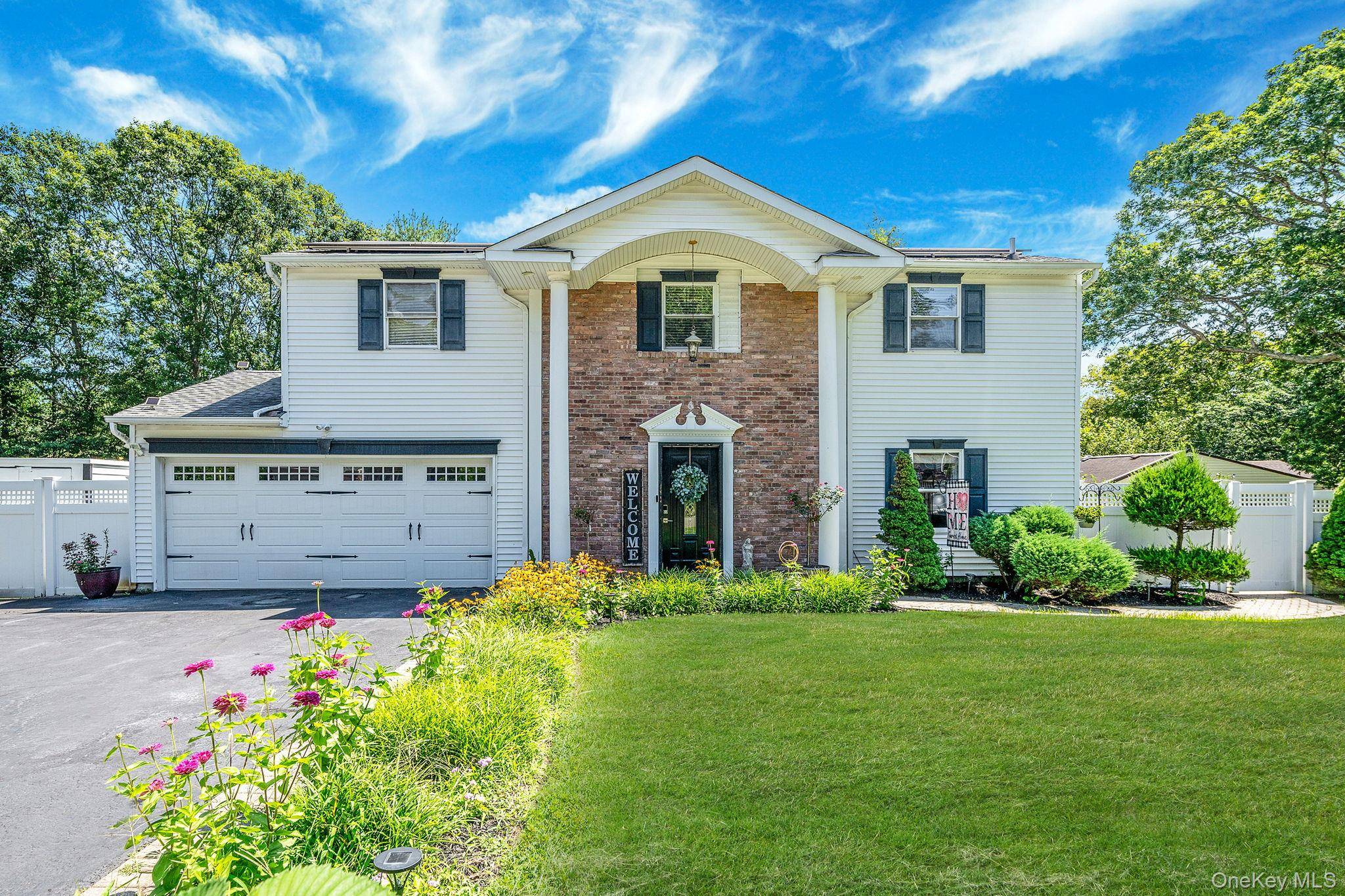 Welcome to this beautiful Colonial in the W section of Coram in Middle Country School district.