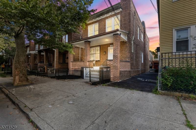 Welcome to 165 Van Nostrand Avenue, a beautifully renovated brick two family home located in the heart of Jersey City's Greenville section.