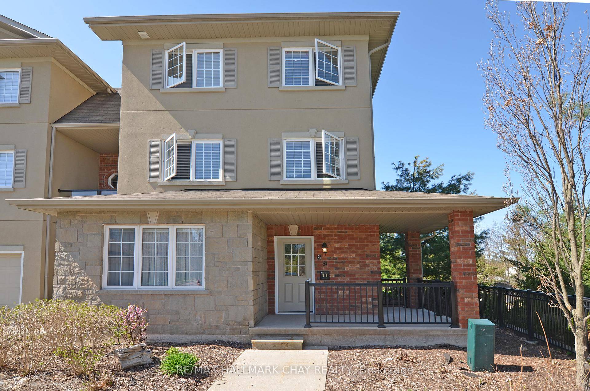 Welcome to 49 Ferndale Drive South, Unit 8, a bright and stylish ground level end unit in Barrie's sought after Ardagh Bluffs community.