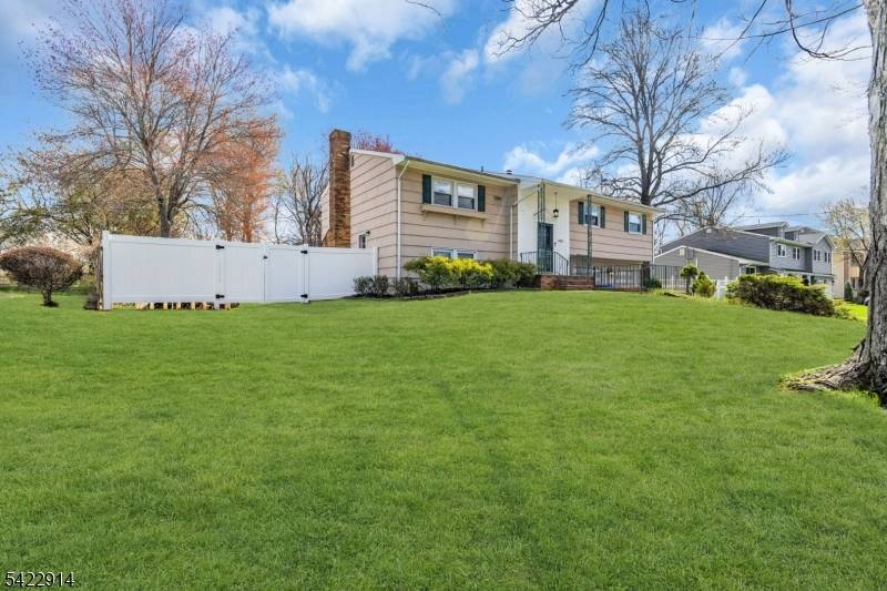 Beautifully well maintained Bilevel home sweet home with 4 bedrooms 2 full bathrooms featuring hardwood floors throughout and efficient baseboard heating along with cozy wood burning fireplace on 1st floor.