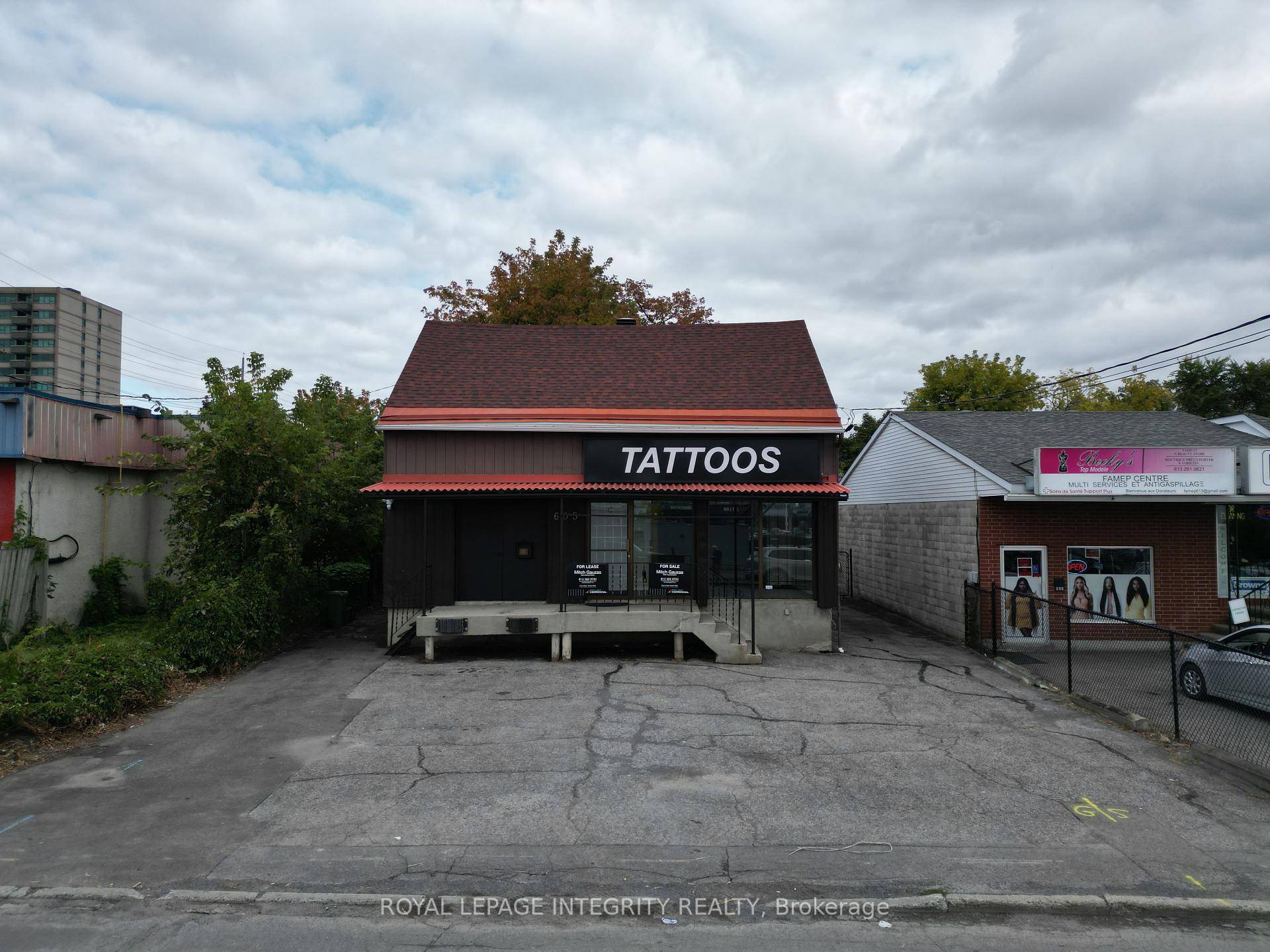 Retail residential duplex for sale near the intersection of Montreal Road and Center Street.