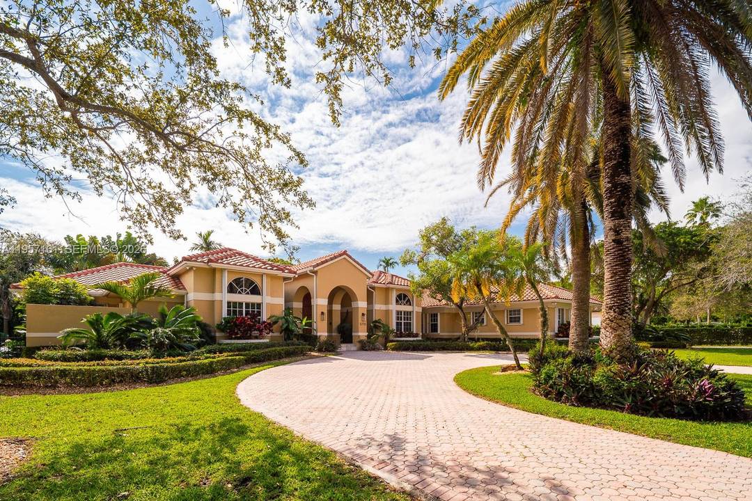 Step into timeless elegance in this Tuscan inspired estate, perfectly set on a lush 31, 888 SF lot with a heated saline swimming pool designed for year round enjoyment.