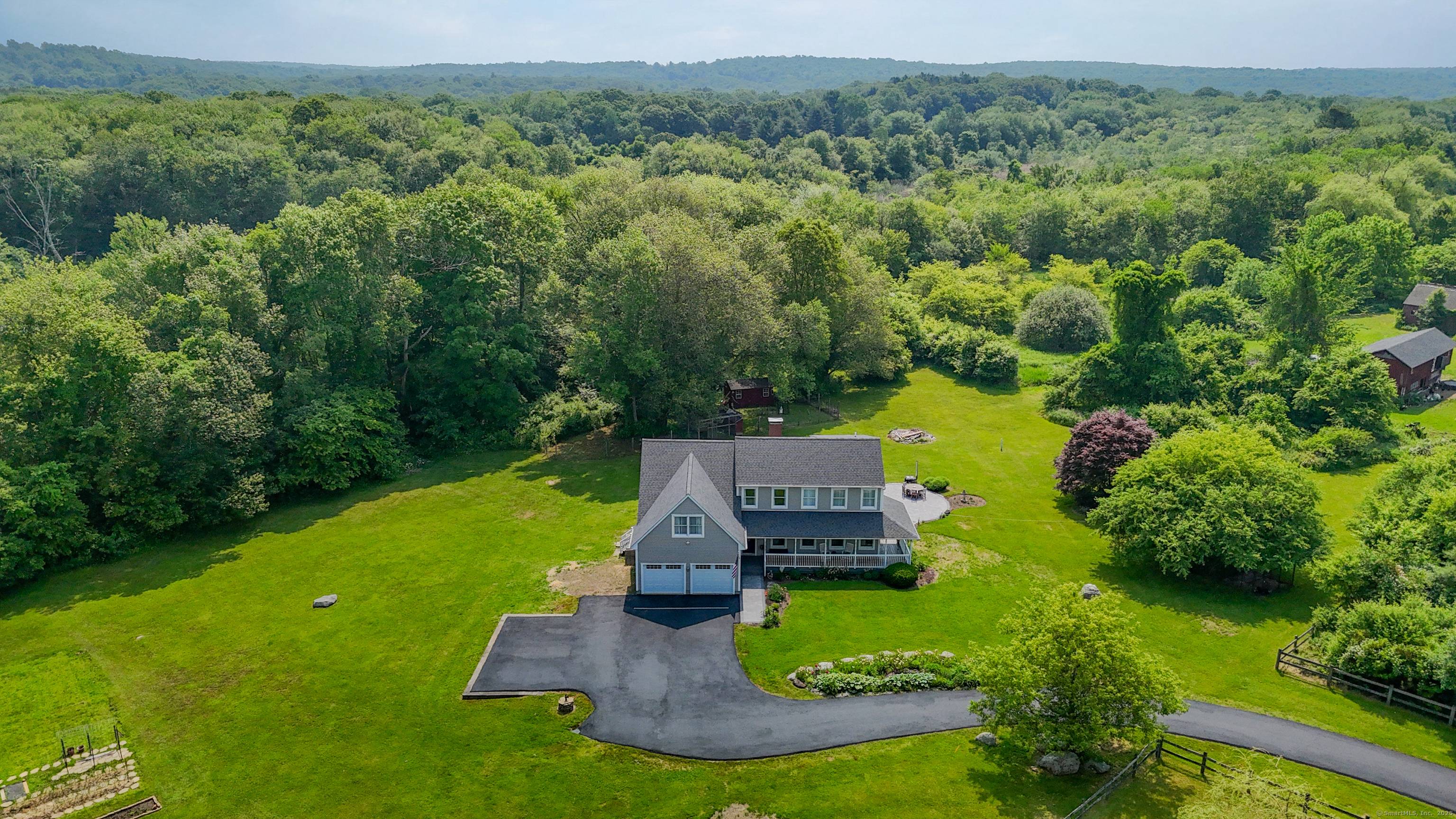 Welcome home as you drive down your newly paved 350 ft.