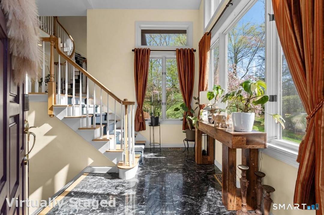 Tucked away at the top of a private Monroe cul de sac, this one of a kind custom contemporary is the definition of elevated living.