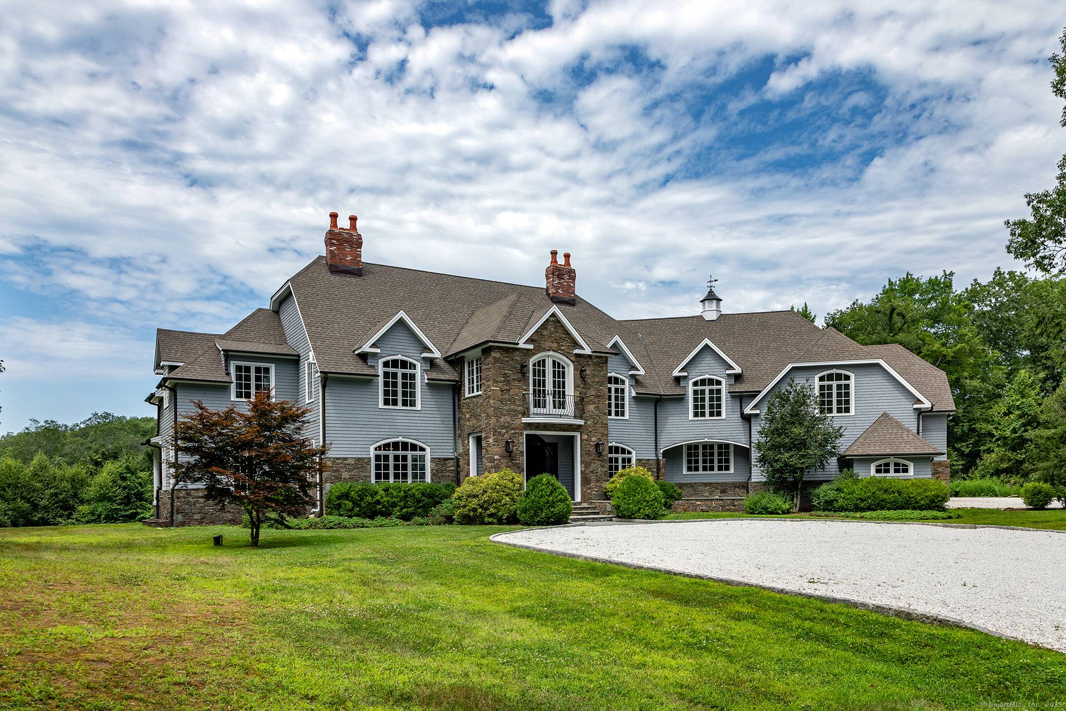Long gracious driveway leads you to the formal yet comfortable country house set privately on the property for peaceful enjoyment.