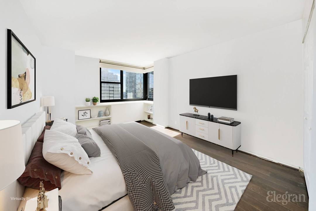 This top floor corner one bedroom, one bathroom home spans 677 square feet and offers open views of the East River and downtown skyline.