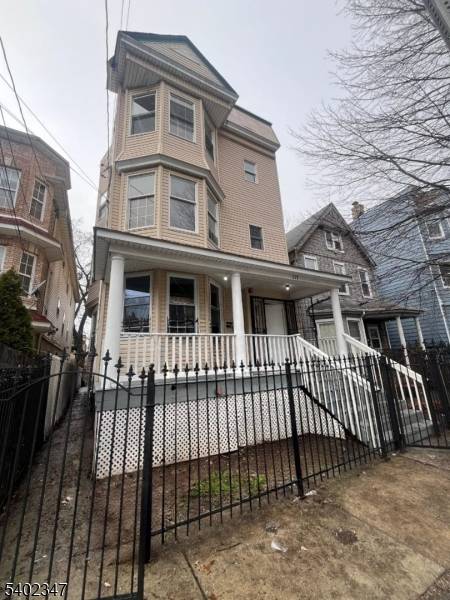 Experience this spacious multi story residence featuring classic architectural details and strong curb appeal.