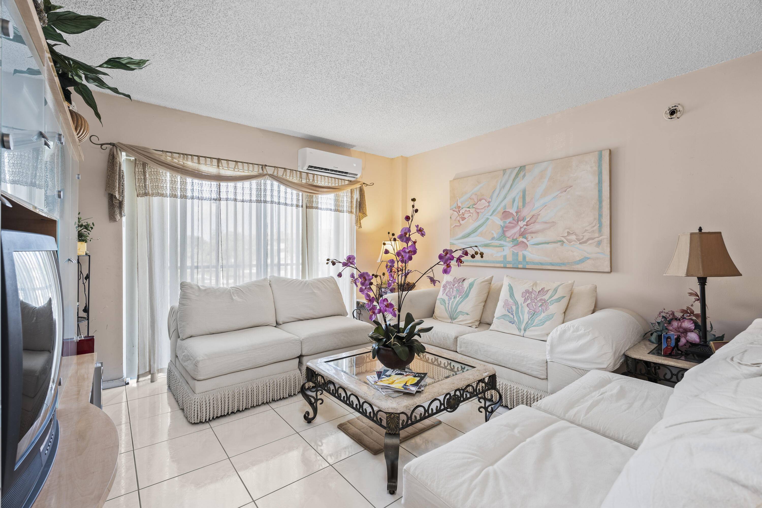 Experience serene living in this charming condominium nestled within a prestigious golf course community.