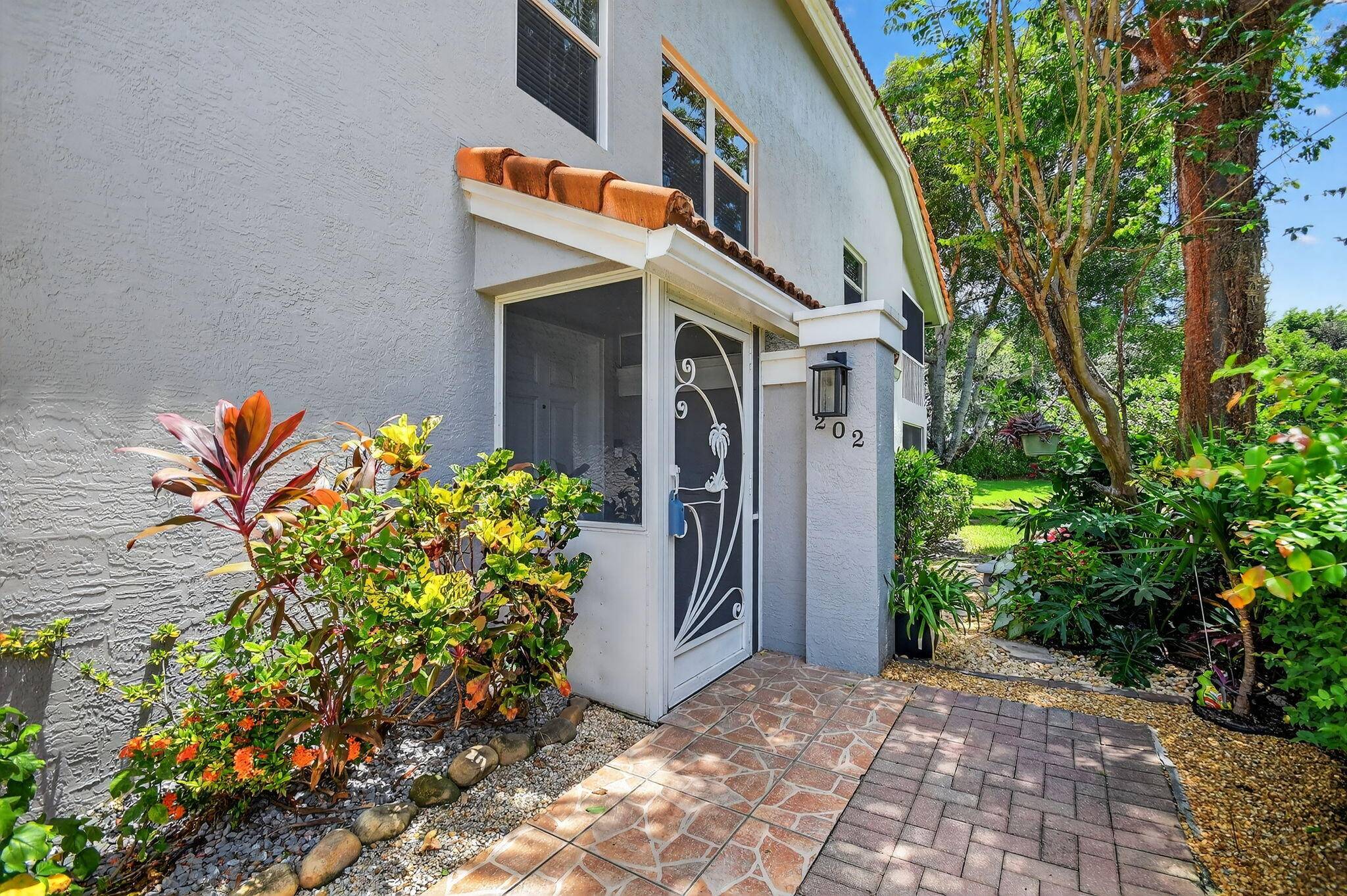 Come experience Florida living at its finest in this beautiful end unit with open floor plan and perfect, serene location with lake views.