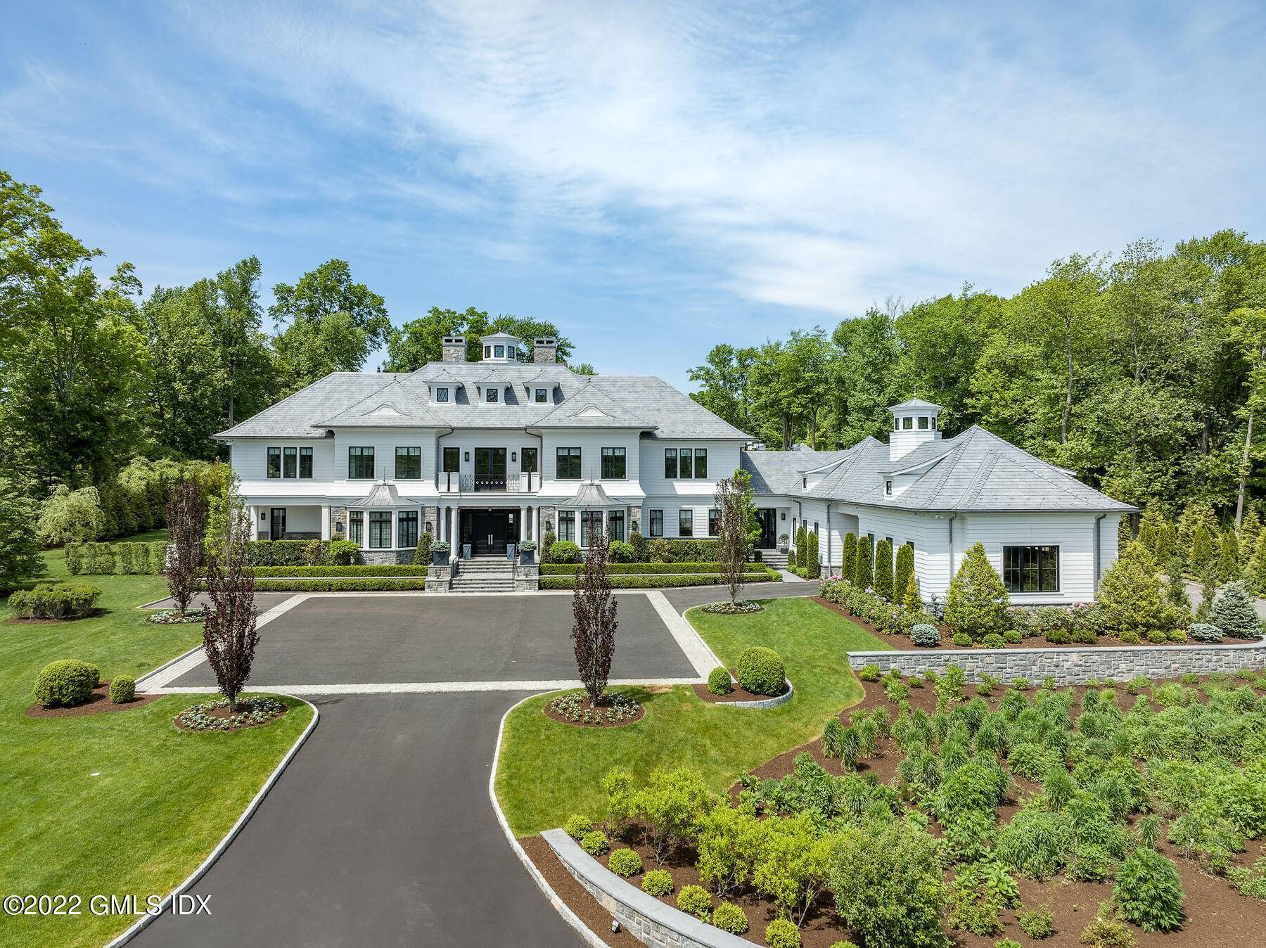 Polished and sophisticated custom built home on 4 secluded acres, appointed with exquisite finishes and luxurious detailing.