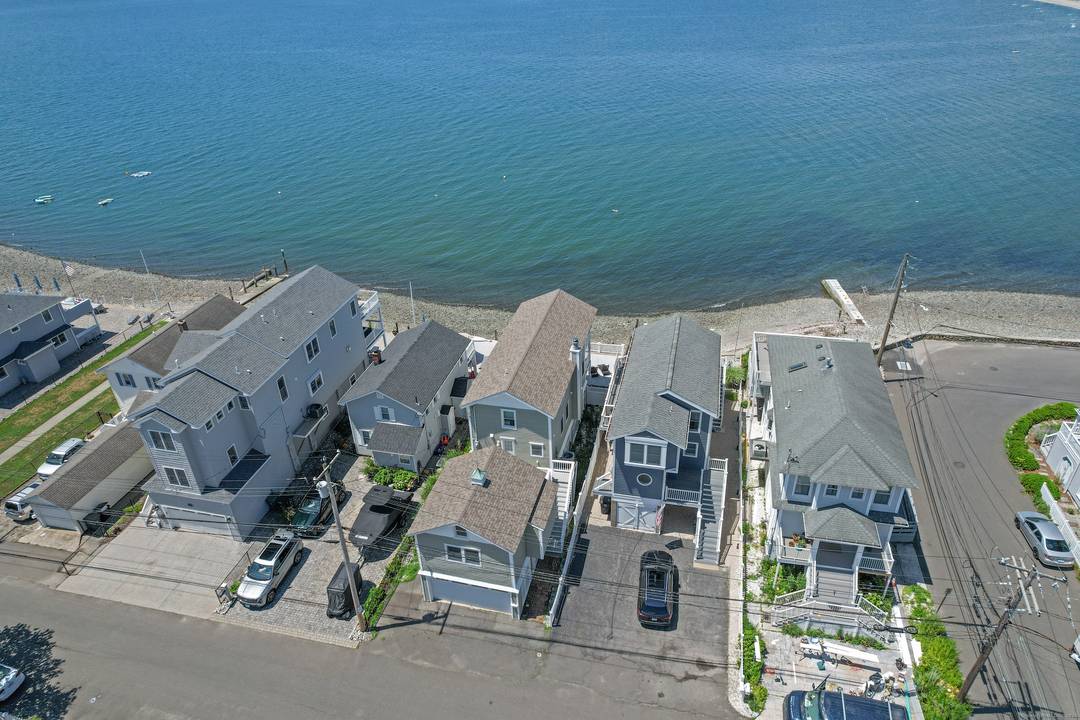 Enjoy the best of coastal living in this fully furnished direct waterfront home in Milford's Point Beach community.