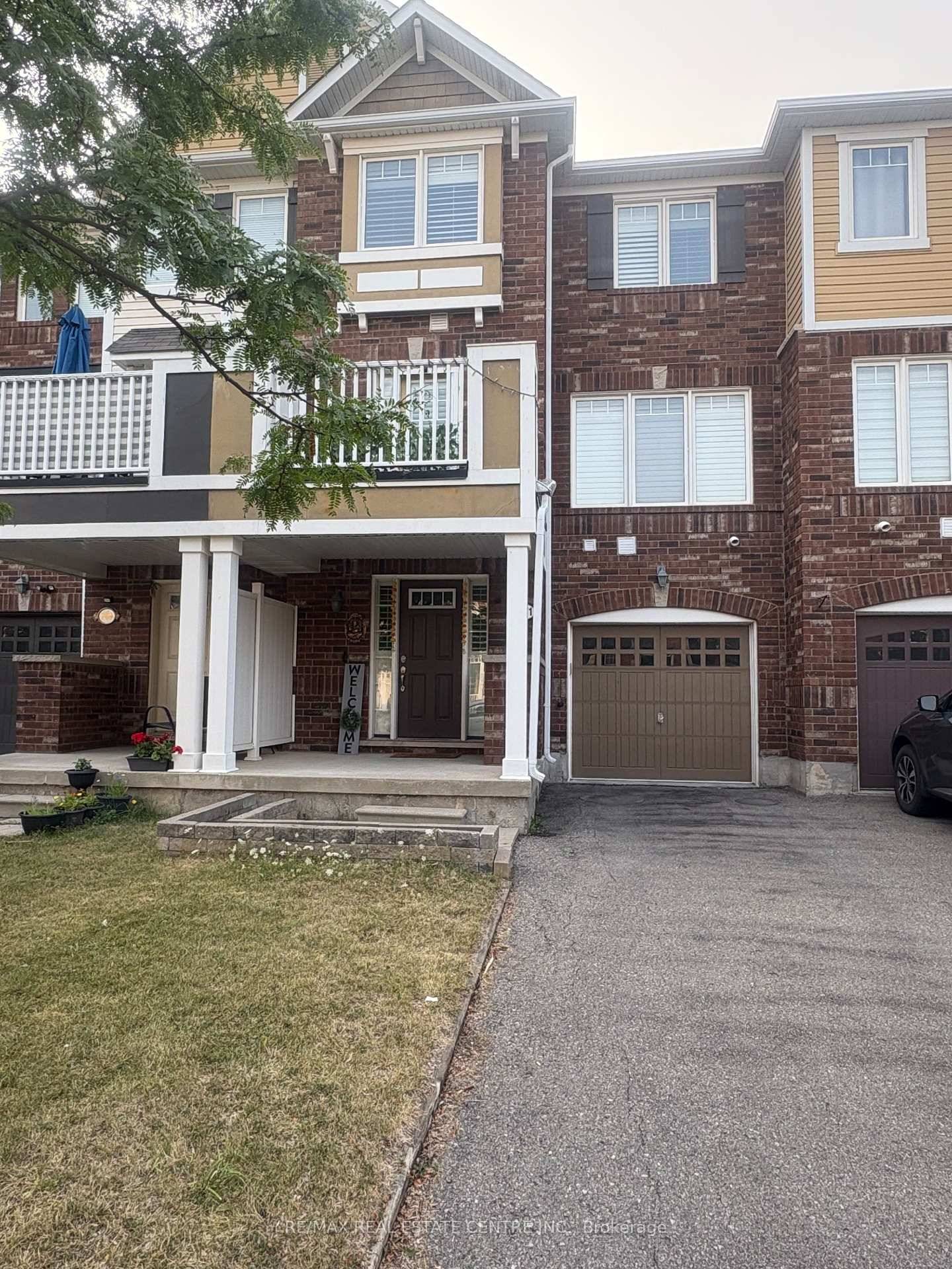 Well Maintained Freehold Townhouse with Two Parking Spaces in the Driveway and One in the Garage.