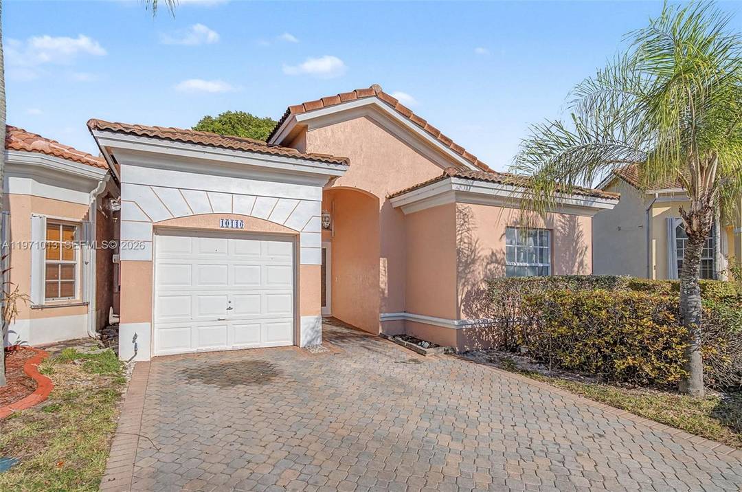 Corner lakefront 3 bedroom, 2 bath townhome with attached 1 car garage and driveway parking.