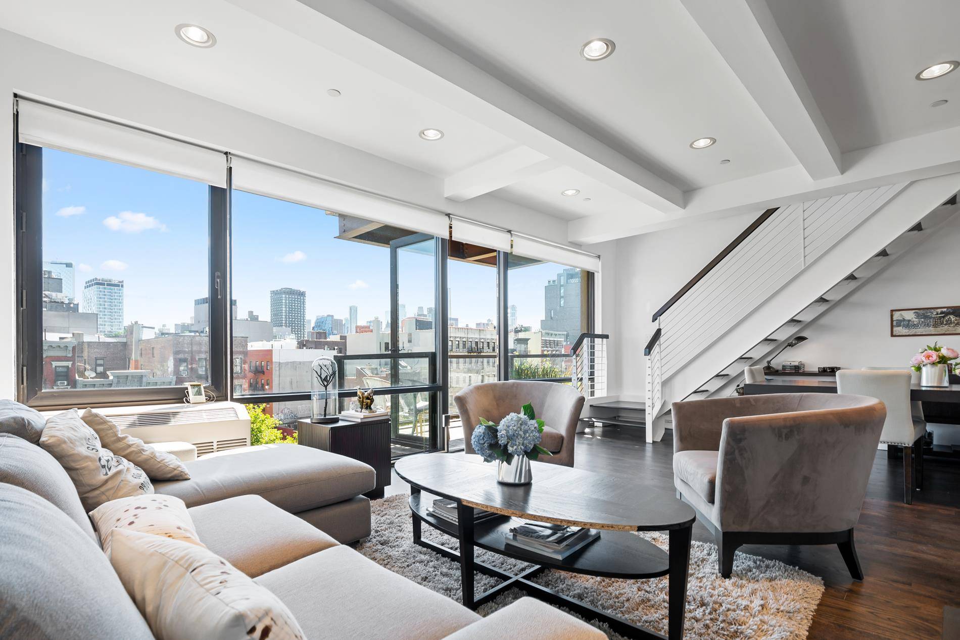 Welcome to your extraordinarily spacious and light apartment with floor to ceiling windows at Lower East Side !