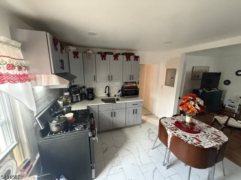 Visit this rare SIDE BY SIDE DUPLEX legal 2 family home.