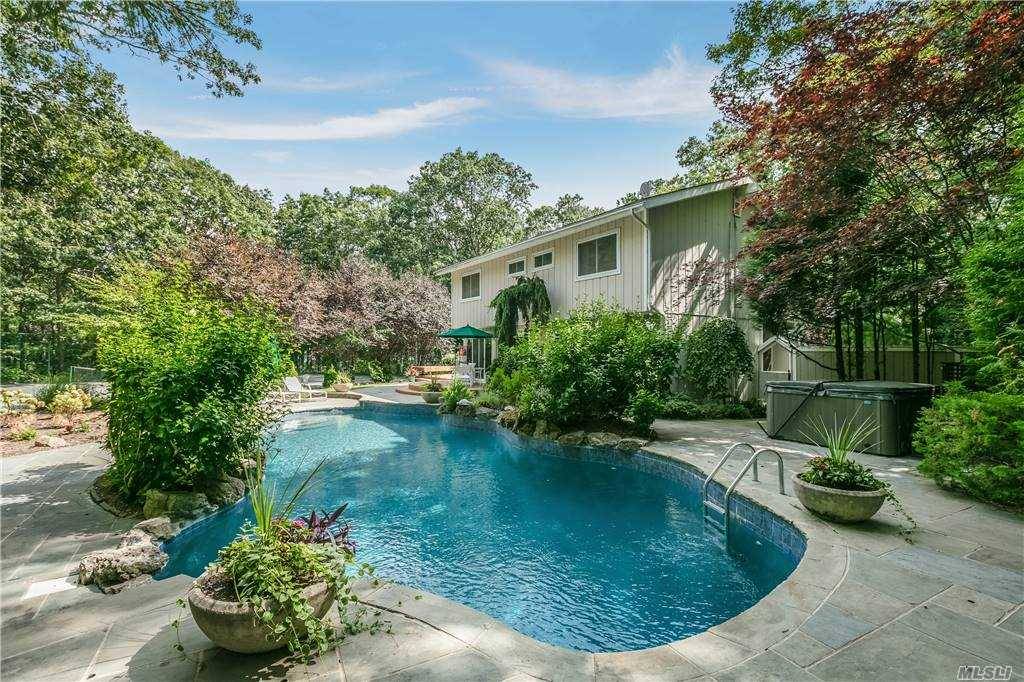 Spend your summer in this private Westhampton oasis.