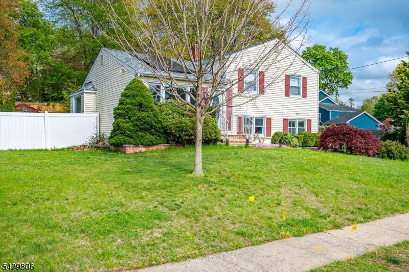 Welcome to this charming South Plainfield home, perfectly situated on a quiet street in the Woodland Park Homes neighborhood.