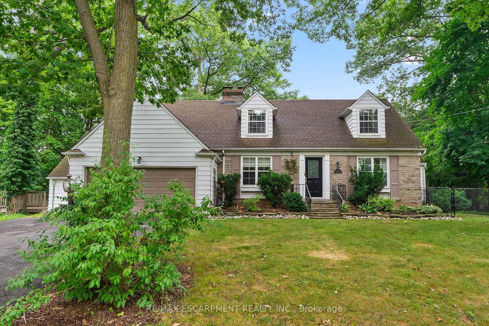 Welcome to this charming home on one of Oakville's most desired streets.
