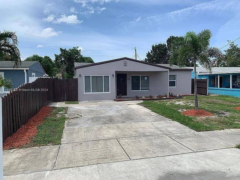 Beautifully redone 4 bedroom, 2 bath house with 80k hurricane impact windows, oversized master bedroom with huge walk in closet and large shower.