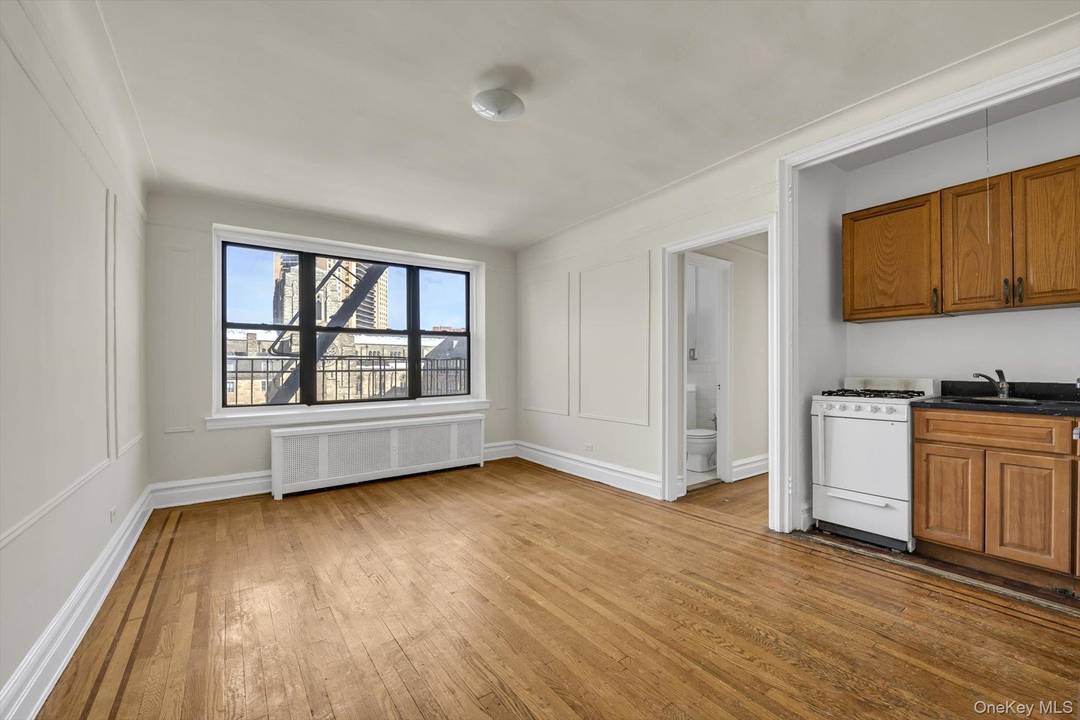 Discover your new home in the heart of Forest Hills with this bright and sunny one bedroom condo, perfectly situated on the vibrant Austin Street.