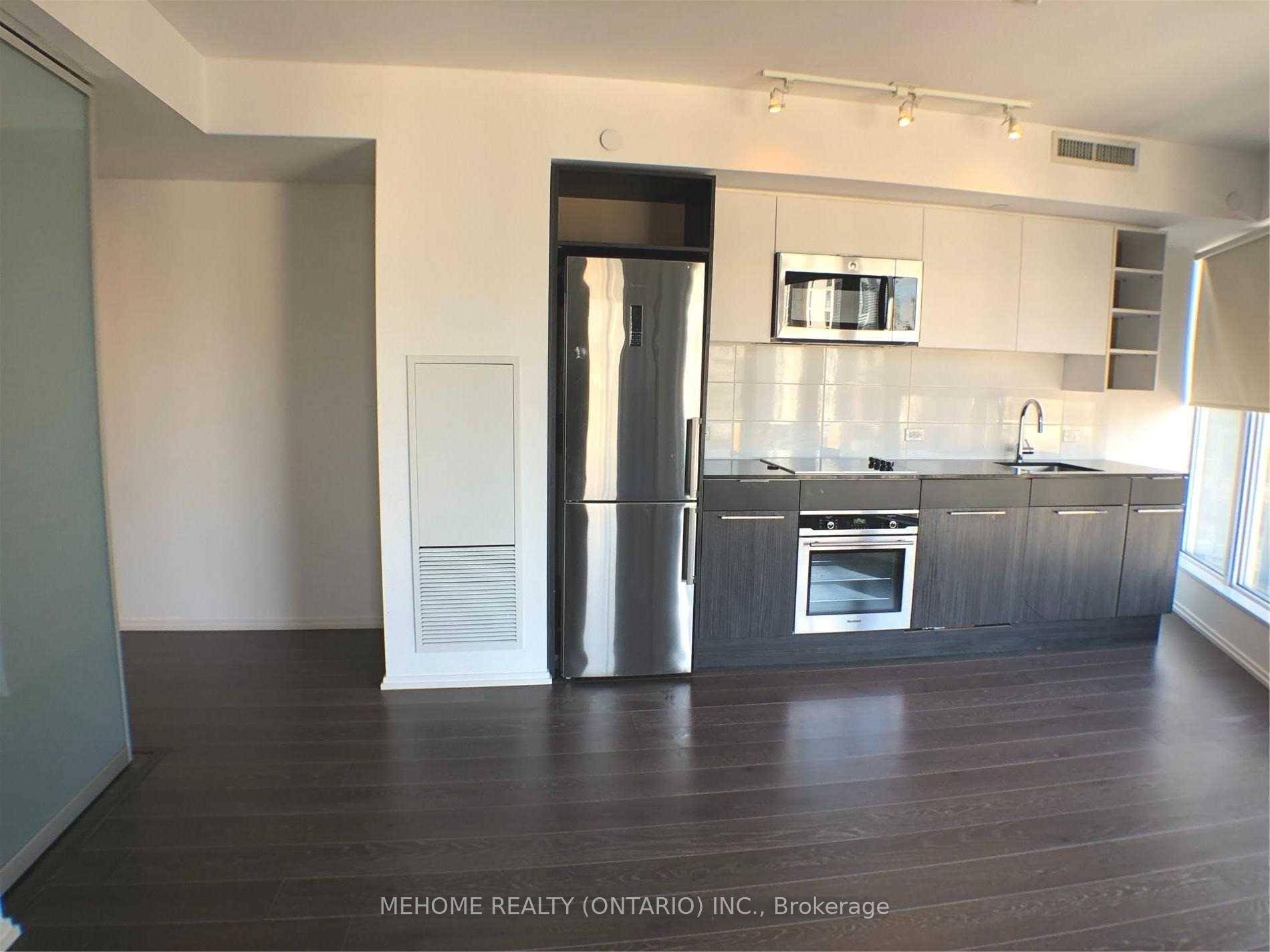 A Bright Corner Unit of 1 Den Plus Locker Parking Spot Included At Luxury Core Condos Yonge amp ; Church St.