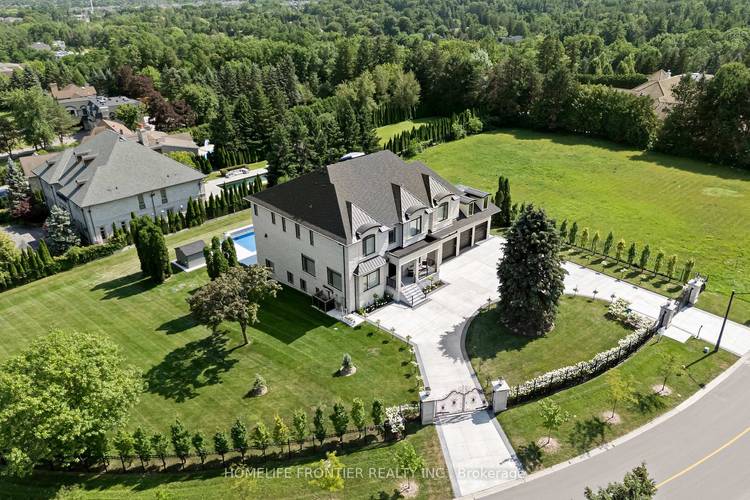 Welcome to an extraordinary custom estate in the exclusive Woodland Acres community an unforgettable residence that feels straight out of a luxury design magazine.