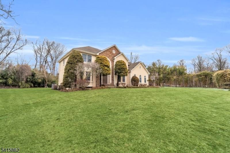 Welcome to this beautifully situated single family home in Old Tappan offering privacy and space on approximately 1.