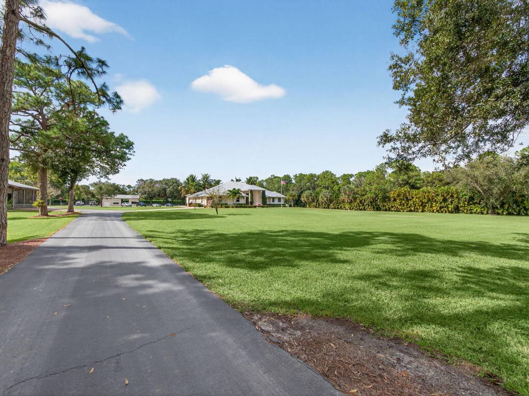 Welcome to a rare estate of distinction in the heart of Jupiter Farms 17593 Winterhawk Trail, a 5.