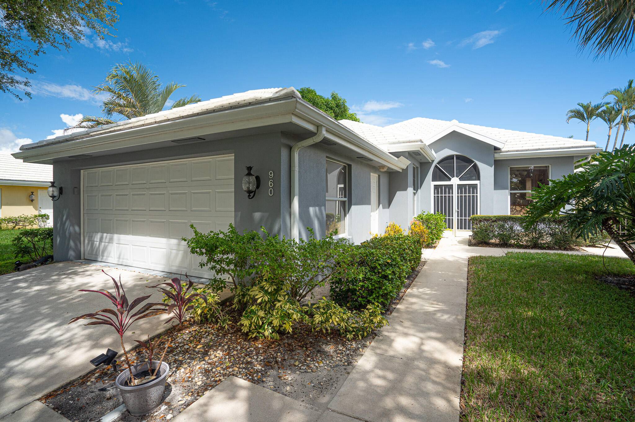 Stunning Views ! Enjoy South Florida living in the sought after gated community of Bear Island.