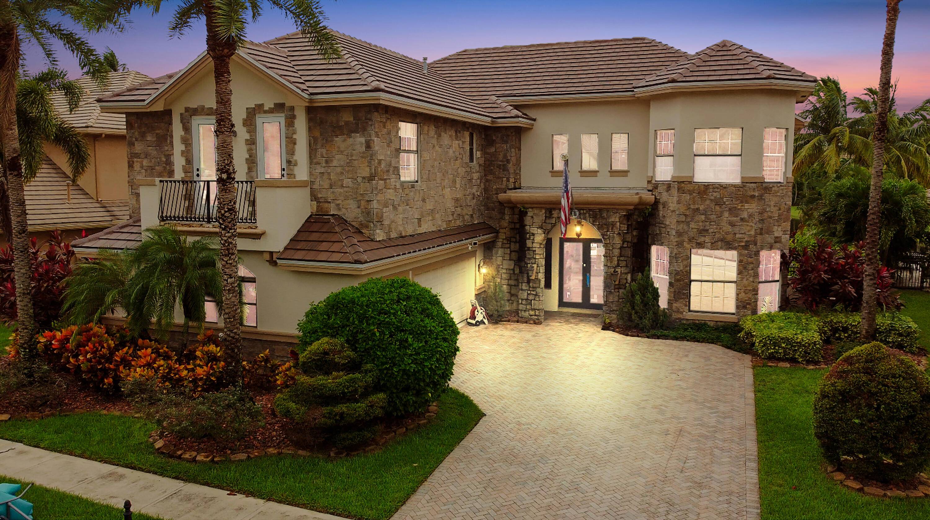 Prepare to be enchanted by this truly magnificent waterfront estate, perfectly nestled in a desirable, lake front community in Wellington.