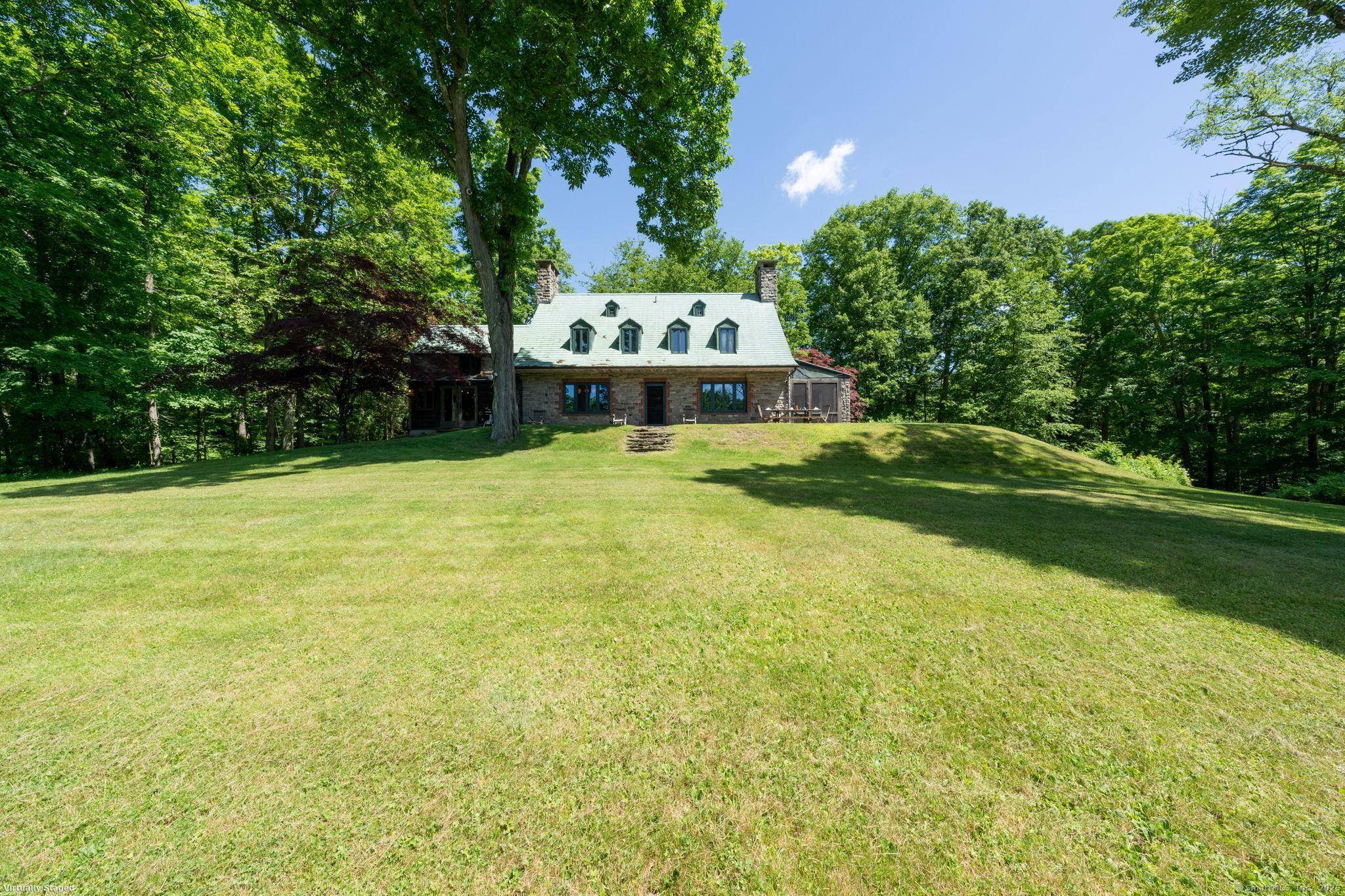 Originally designed and custom built on site with stones from property for local Doctor as a private English style hunting cottage in 1922.