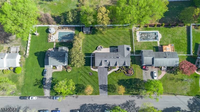 Welcome to this truly exceptional, fully renovated home in the heart of Pequannock, where modern design meets everyday comfort convenience.