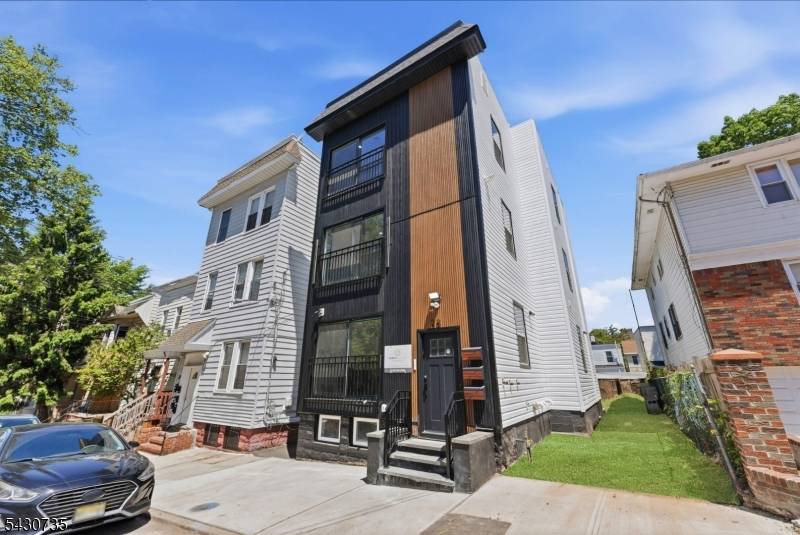 Elegantly transformed legal 3 family in Irvington, everything new except the foundation.