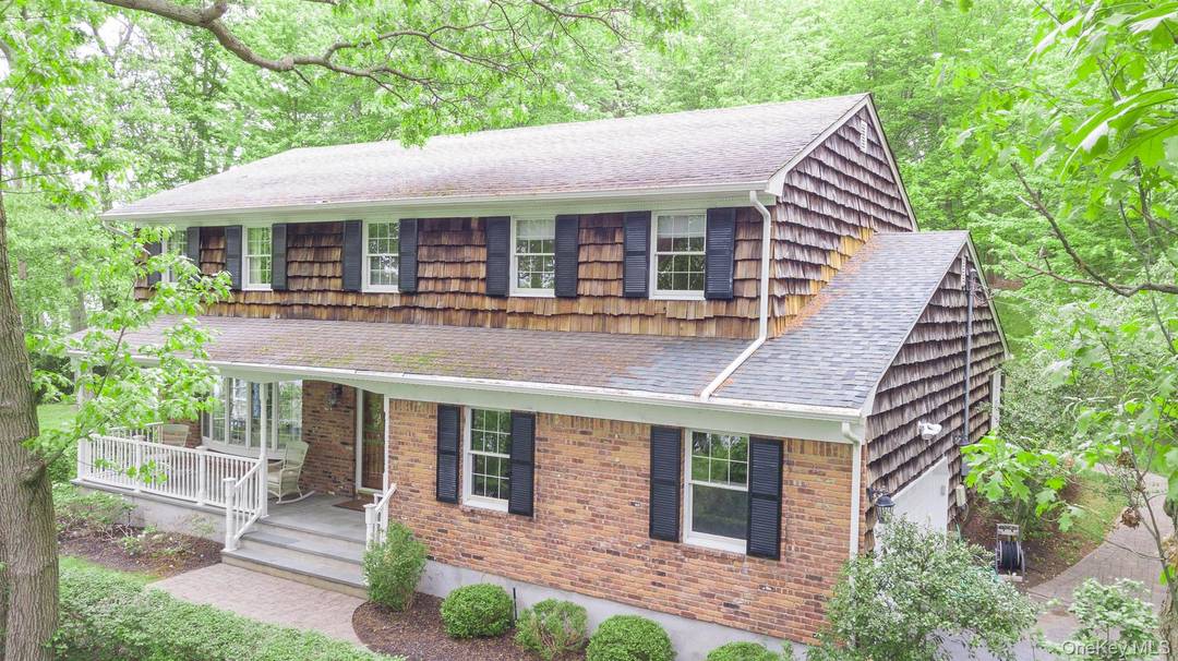 Recently Remodeled Colonial Home on 2 Acres of Property Overlooking the Nissequogue River with Rocking Chair Front Porch.