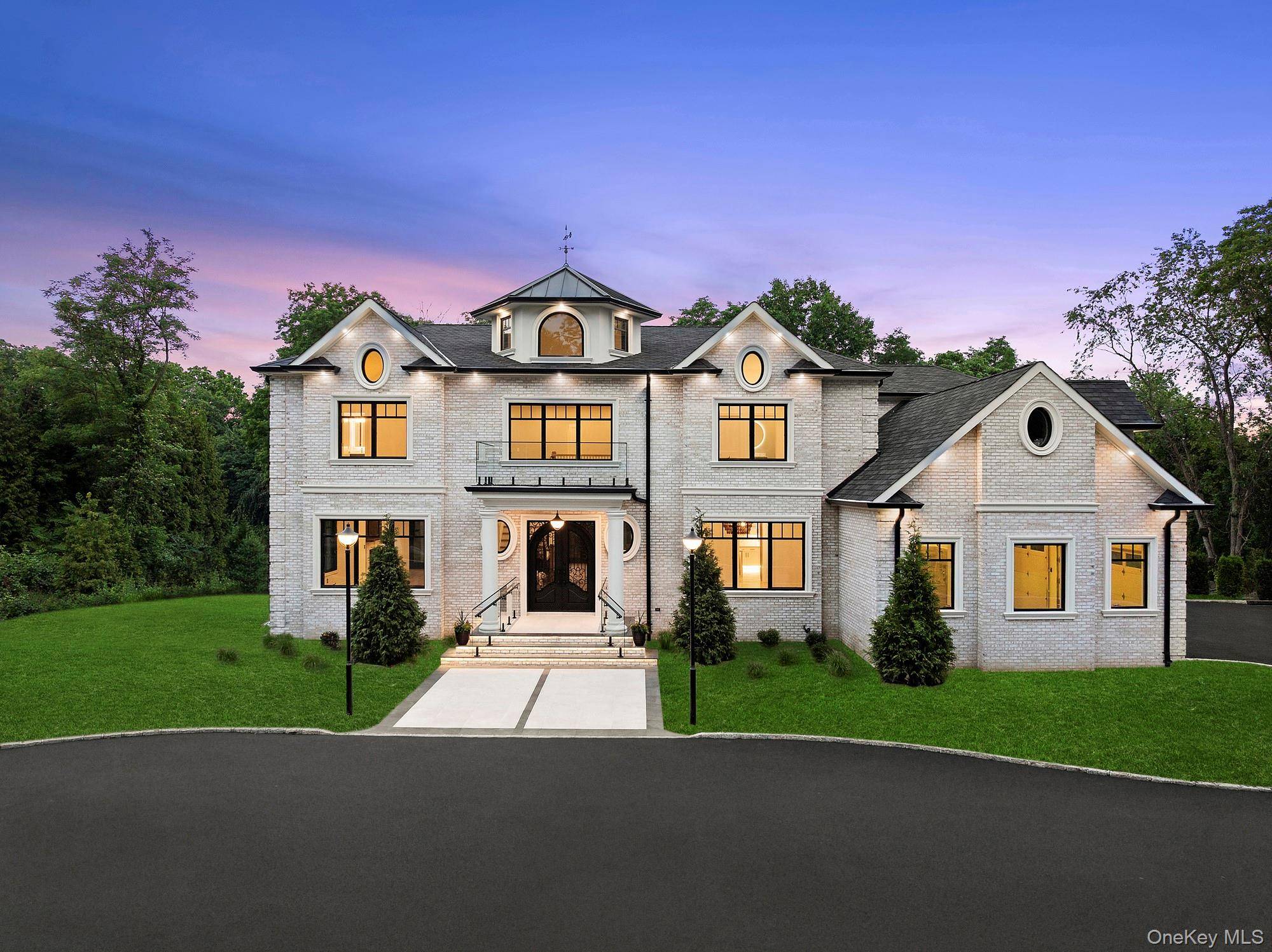 Discover a new level of luxury in this exquisite all brick residence, newly constructed and perfectly situated in one of Old Westbury s most prestigious private cul de sacs.