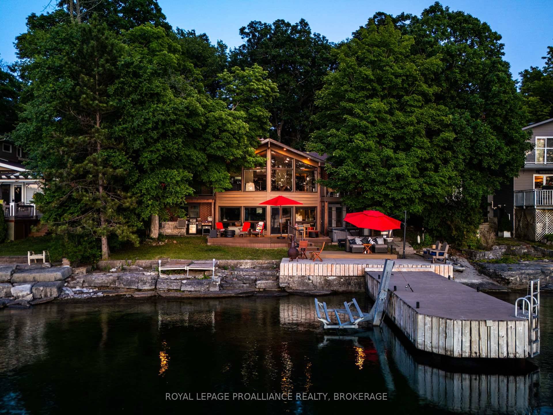 Welcome to 306 Nicholson Point Road, a breathtaking waterfront retreat nestled on a beautifully treed lot with over 70 feet of clean, deep shoreline on Parrots Bay.