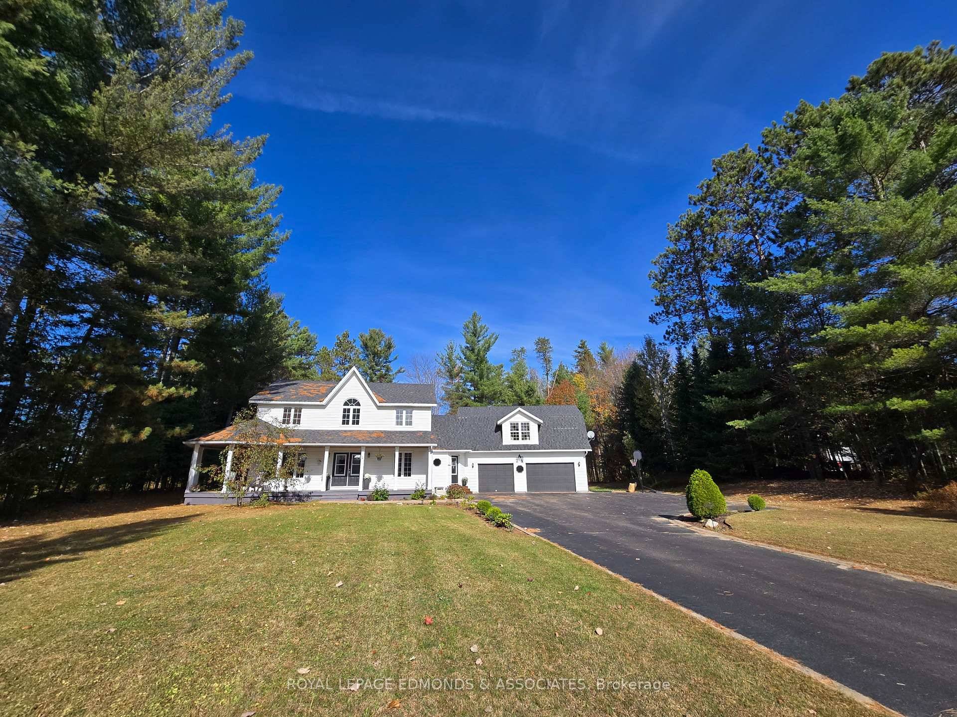 This stunning executive Cape Cod home offers a unique blend of elegance and modern convenience, nestled on over an acre of land right in town.