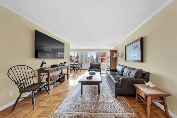 Welcome to this stunning high floor Junior 4 at the highly coveted 360 East 72nd Street.