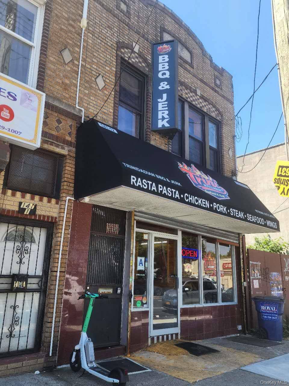 Solid brick attached mixed use building available for sale on Rockaway Avenue in Jamaica.